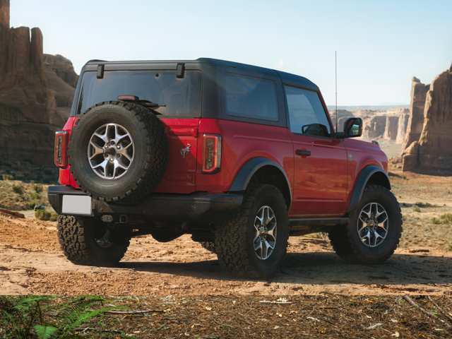 Rear profile view of a red 2023 Ford Bronco in a desert area. | Ford dealer in Altoona, PA | Courtesy Ford Lincoln