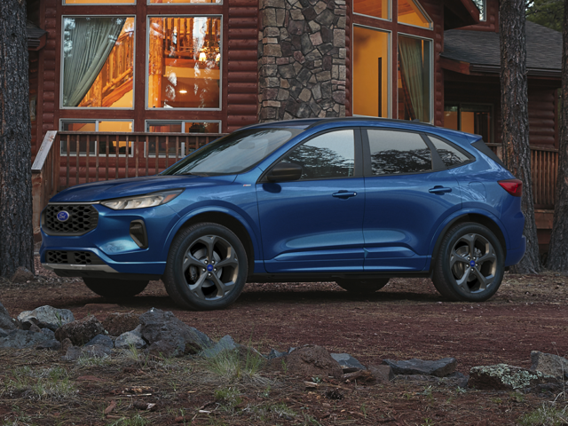 Profile view of a blue 2024 Ford Escape parked in front of a cabin. | Ford dealer in Altoona, PA | Courtesy Ford Lincoln