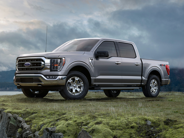 Front profile view of a silver 2023 Ford F-150 parked in a field. | Ford dealer in Altoona, PA | Courtesy Ford Lincoln